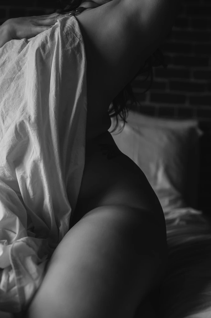 artistic photo of a woman posing with a sheet